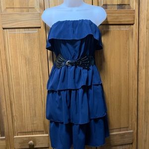 Cocktail dress with ruffle layers. Belt included